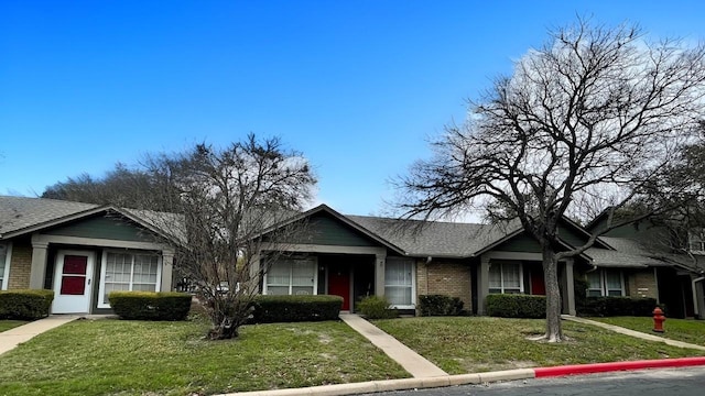 ranch-style home with a front yard