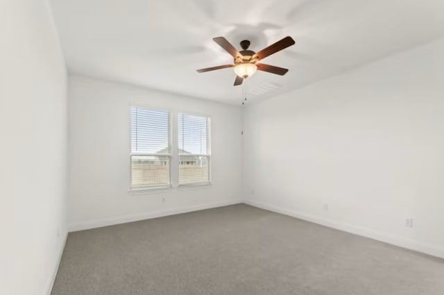 spare room with carpet floors and ceiling fan