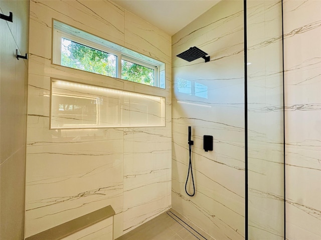 bathroom featuring tiled shower