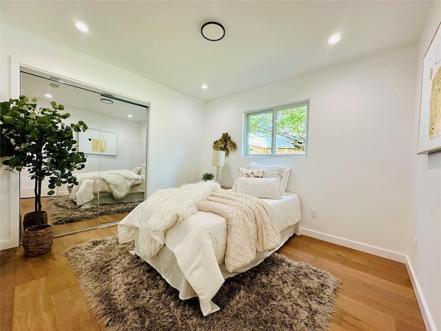 bedroom with light hardwood / wood-style flooring