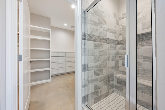 bathroom with a shower with shower door