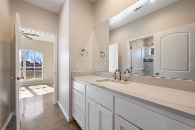 bathroom with ceiling fan, concrete floors, and vanity