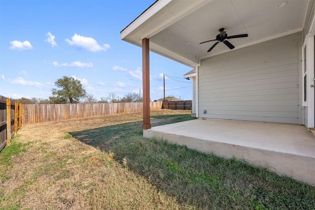 view of yard featuring ceiling fan and a patio area