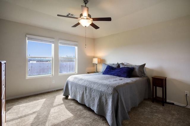 bedroom with ceiling fan and carpet floors