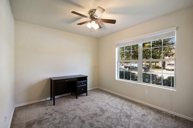 interior space featuring ceiling fan and carpet