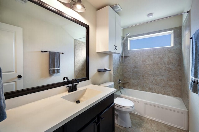 full bathroom with toilet, tiled shower / bath combo, and vanity