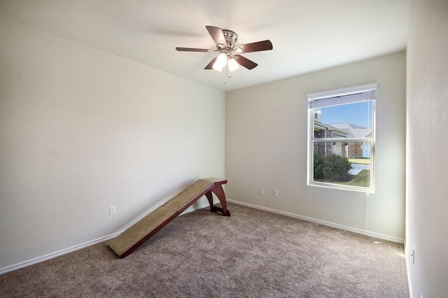 empty room featuring carpet and ceiling fan