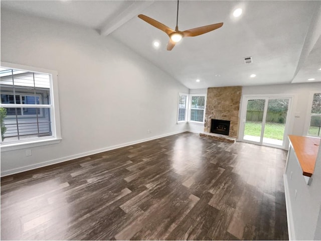 5103 Ganymede Dr, Austin, TX 78727 - unfurnished living room with dark wood finished floors, a ceiling fan, a stone fireplace, recessed lighting, and baseboards