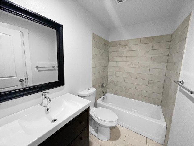 full bathroom with tiled shower / bath combo, toilet, tile patterned floors, and vanity