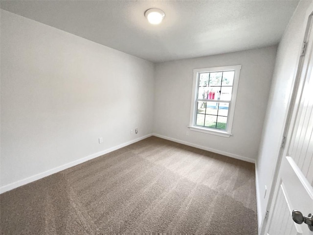 5103 Ganymede Dr, Austin, TX 78727 - spare room featuring carpet flooring and baseboards