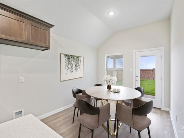 212 Hidalgo Ln, Elgin, TX 78621 - dining space featuring light wood-style flooring, baseboards, lofted ceiling, and recessed lighting