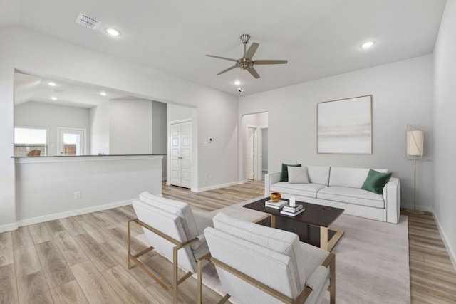 212 Hidalgo Ln, Elgin, TX 78621 - living room with light wood-style flooring, ceiling fan, recessed lighting, vaulted ceiling, and baseboards