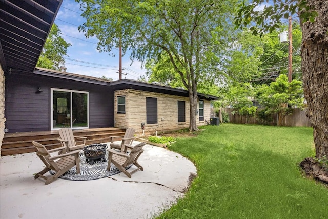 exterior space with fence, central AC, an outdoor fire pit, and a patio area