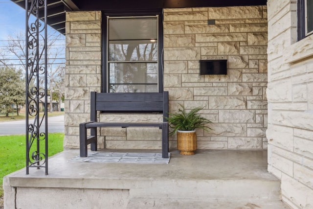 entrance to property with stone siding
