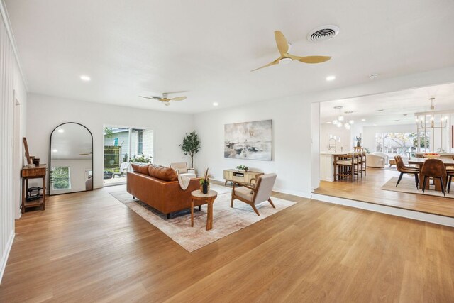 5807 Shoalwood Ave, Austin, TX 78756 - living area with light wood-style flooring, ceiling fan, a chandelier, and recessed lighting