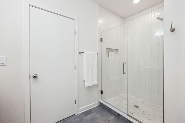 full bathroom with recessed lighting and a stall shower