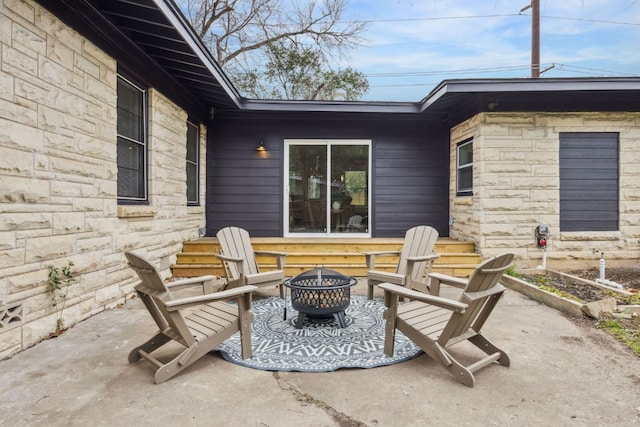 view of patio featuring a fire pit