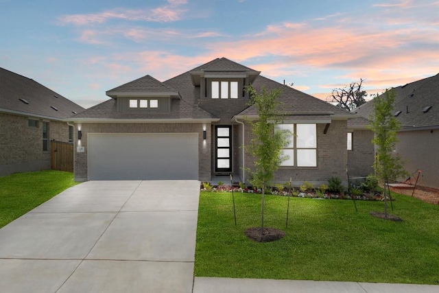 314 Five Mile Creek Way, Kyle, TX 78640 - view of front facade with driveway, brick siding, a front yard, roof with shingles, and an attached garage