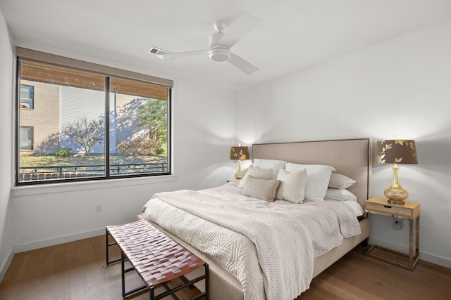 bedroom featuring ceiling fan and dark hardwood / wood-style floors