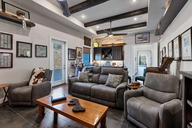 living room featuring beam ceiling and bar