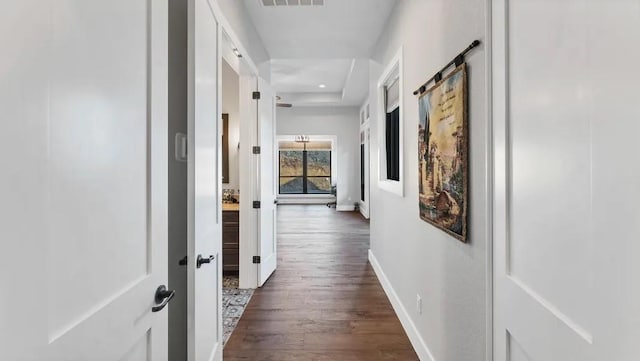 corridor featuring dark hardwood / wood-style flooring