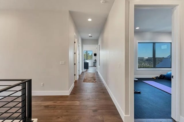 hallway with dark wood-type flooring