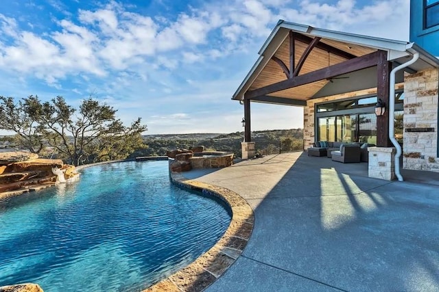 view of pool with a patio area, an outdoor living space, and ceiling fan