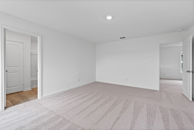 spare room with light carpet