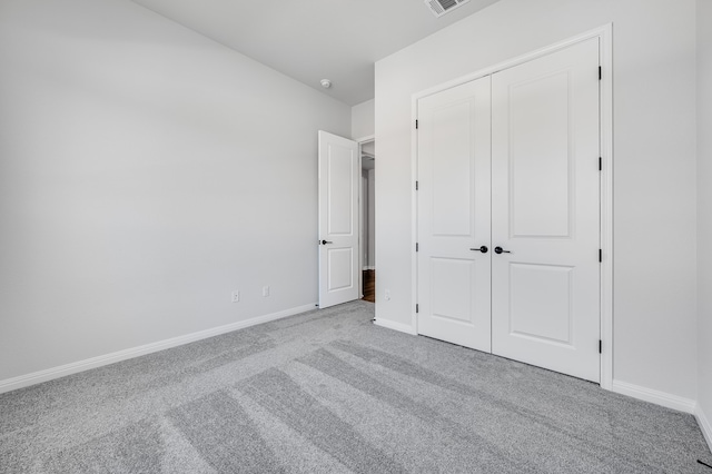 184 Milam Creek Dr, Kyle, TX 78640 - unfurnished bedroom featuring carpet flooring, baseboards, and a closet