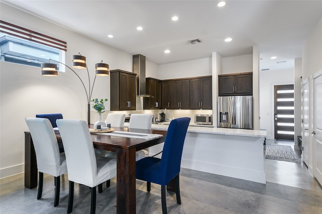 dining room featuring concrete floors