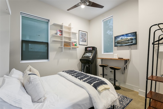 bedroom with ceiling fan and concrete floors