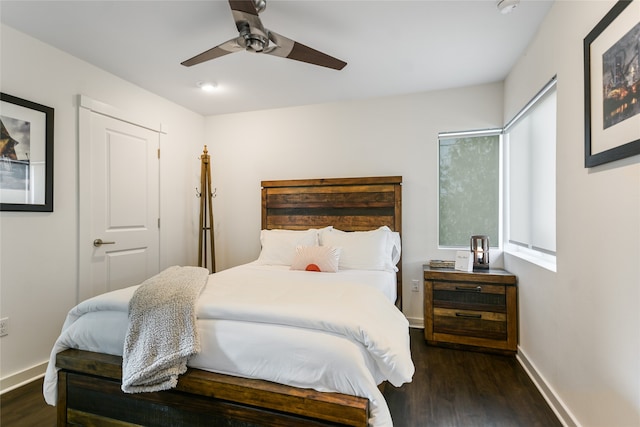 bedroom with ceiling fan and dark hardwood / wood-style floors