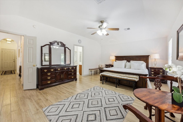 bedroom featuring ceiling fan, vaulted ceiling, and light wood-type flooring