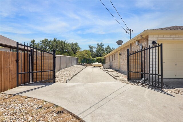 view of gate featuring a garage