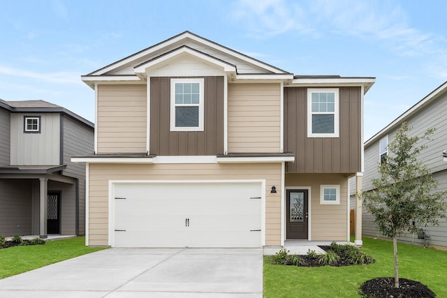 view of front of house featuring a front yard and a garage