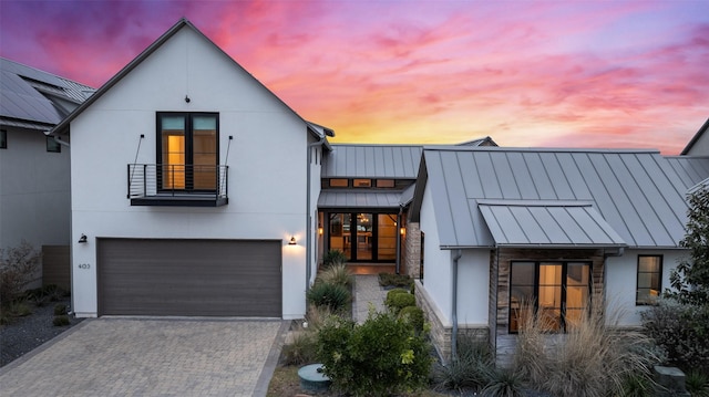 modern inspired farmhouse featuring a garage