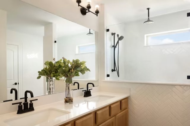 bathroom featuring plenty of natural light and vanity