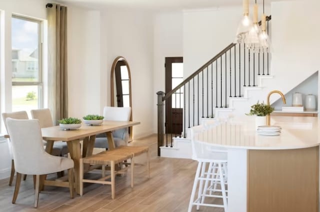 6204 Bower Well Rd, Austin, TX 78738 - dining space featuring light wood-style floors and stairway