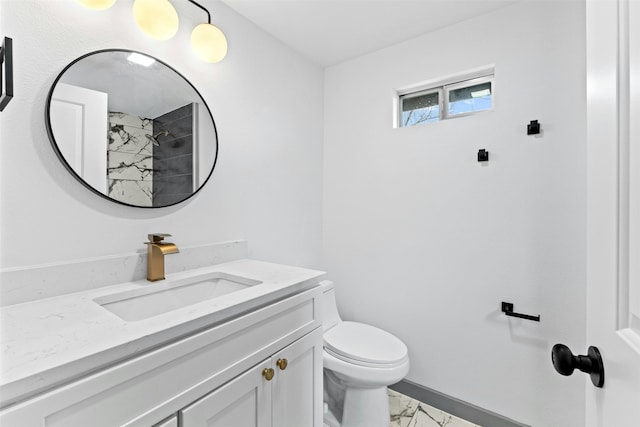 bathroom featuring toilet and vanity