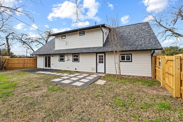 rear view of property with a patio area and a yard