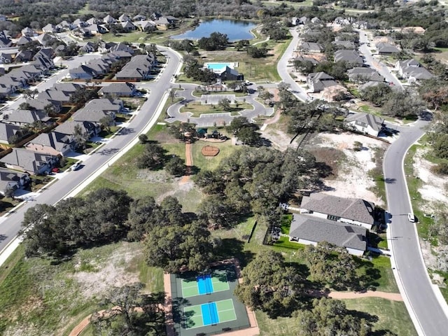 305 Five Mile Creek Way, Kyle, TX 78640 - aerial view of property's location featuring a large body of water, a pool, and nearby suburban area