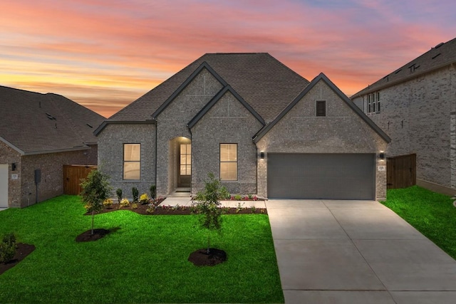 305 Five Mile Creek Way, Kyle, TX 78640 - french provincial home with driveway, an attached garage, and a shingled roof