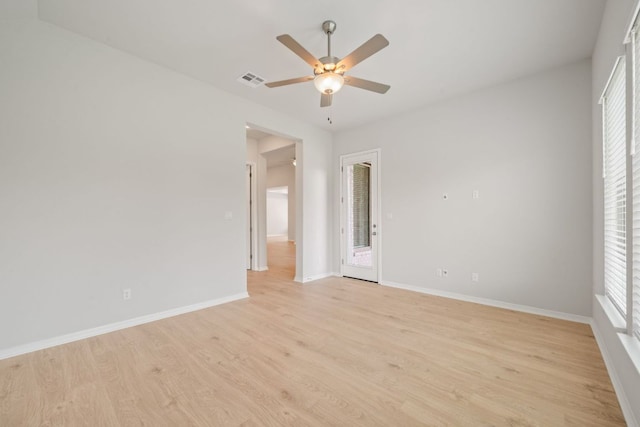 305 Five Mile Creek Way, Kyle, TX 78640 - empty room with ceiling fan, light wood finished floors, and baseboards