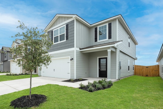 view of front of house featuring a front yard and a garage