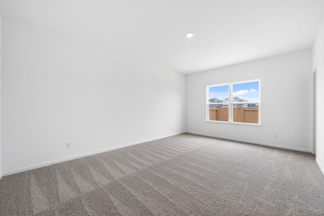 empty room featuring carpet floors