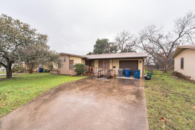 ranch-style home with a garage and a front yard