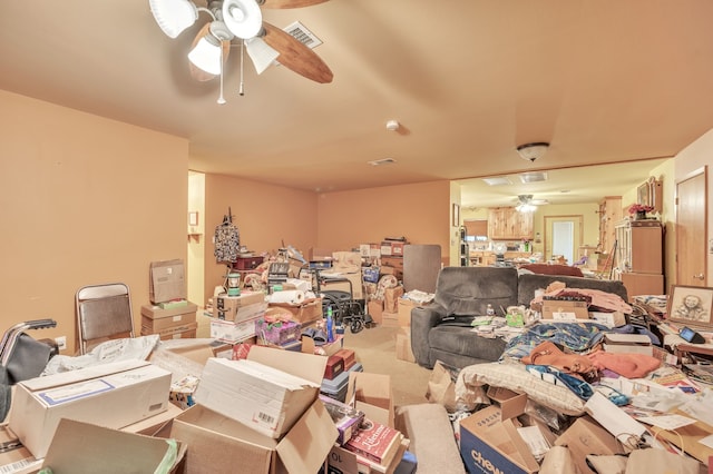 interior space featuring ceiling fan and carpet flooring