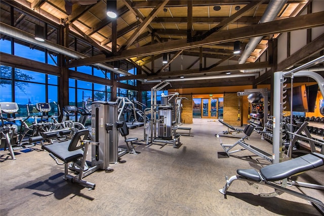 gym with wooden ceiling and high vaulted ceiling