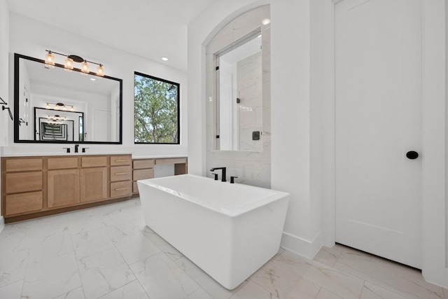 162 Leaning Rock Rdg, Austin, TX 78737 - bathroom featuring marble look tiles, a soaking tub, vanity, recessed lighting, and a shower