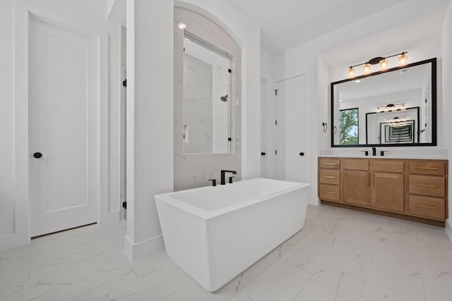 162 Leaning Rock Rdg, Austin, TX 78737 - full bath with marble finish floors, a freestanding tub, and vanity